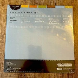 Creative Memories New 8x8 Bountiful Scrapbooking paper in various colors.